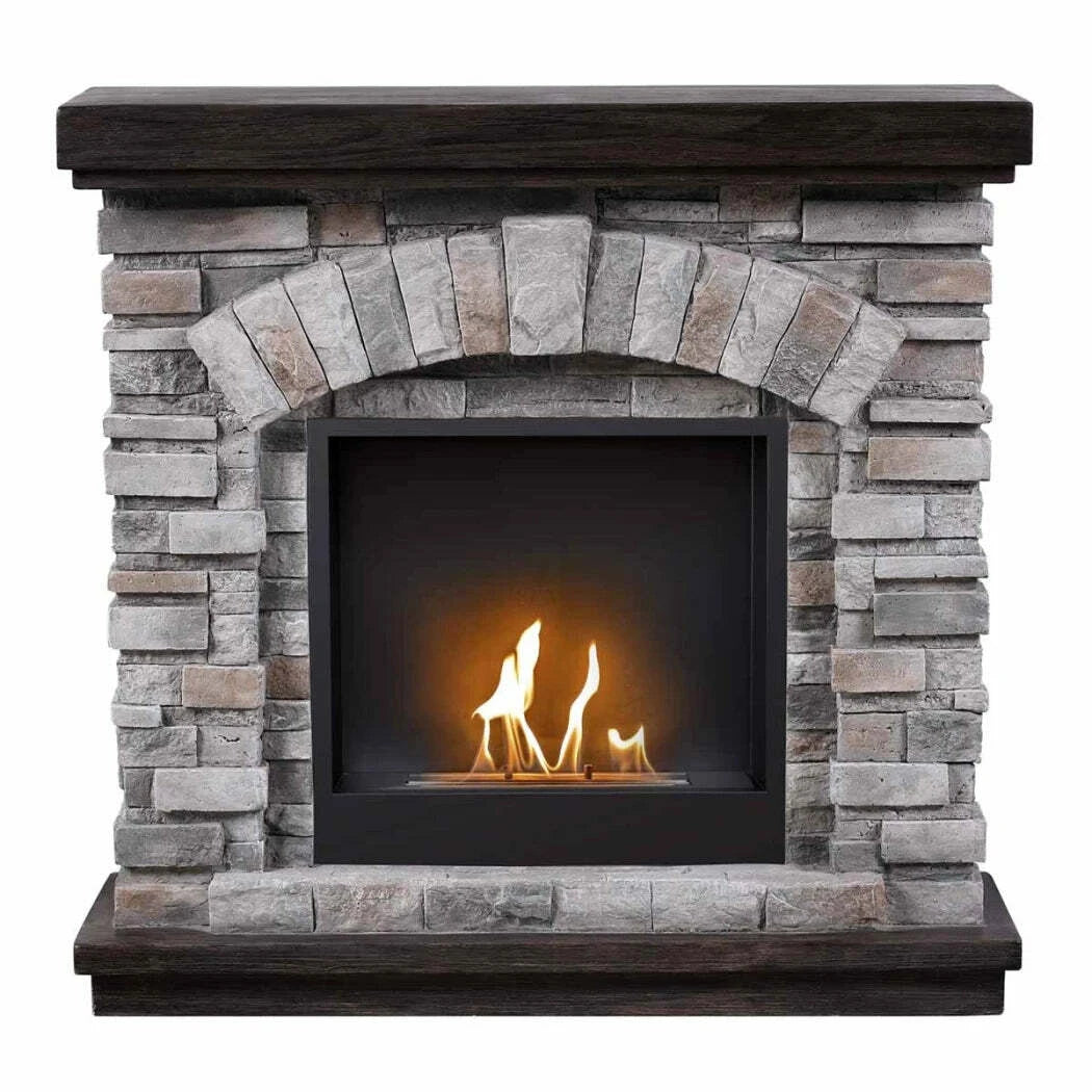 Stone fireplace with a lit fire inside on a white background