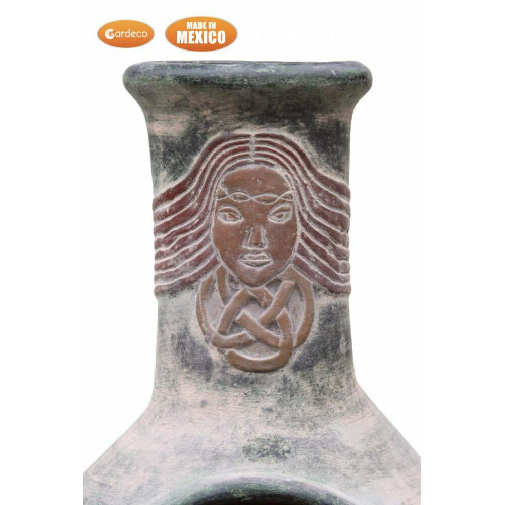 Ceramic chiminea close up of face design and 'Made in Mexico' label on a white background