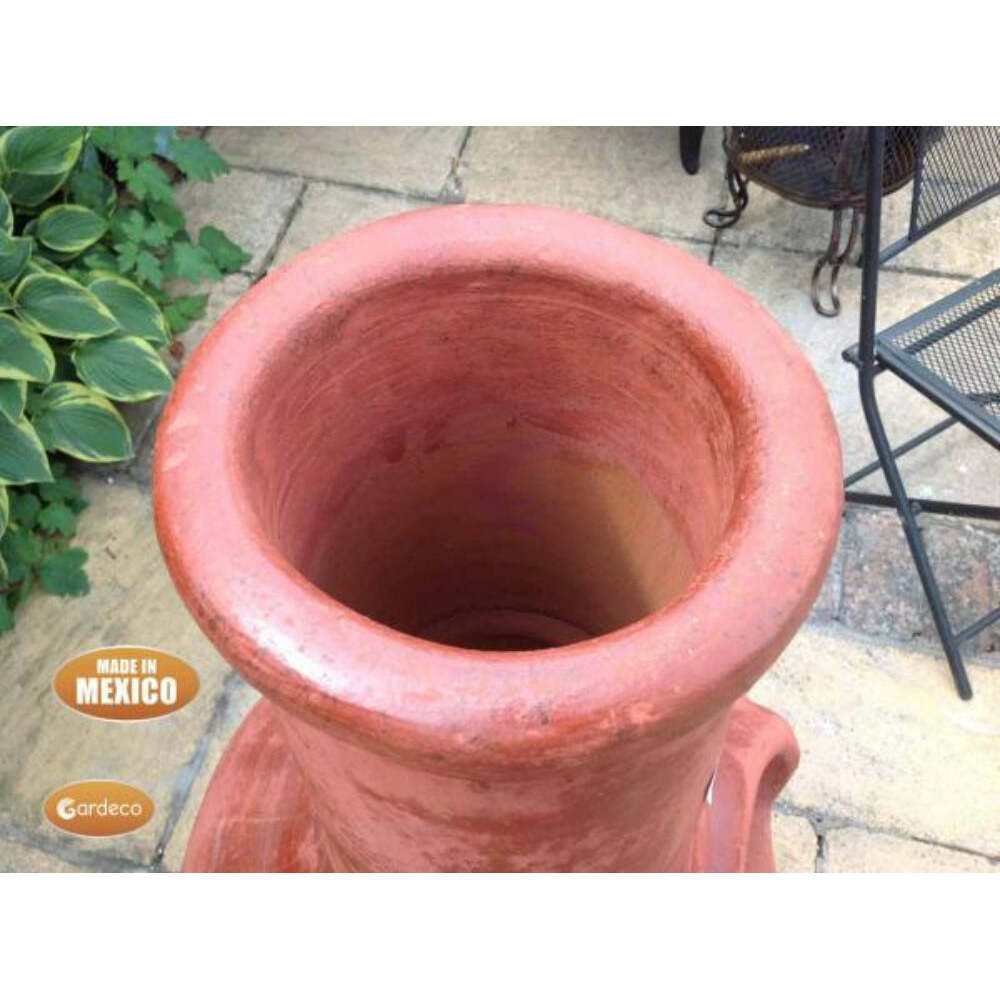 Close up of rim of Jumbo Tibor Mexican Chiminea – Reddish Brown with 'Made in Mexico' label on a patio background