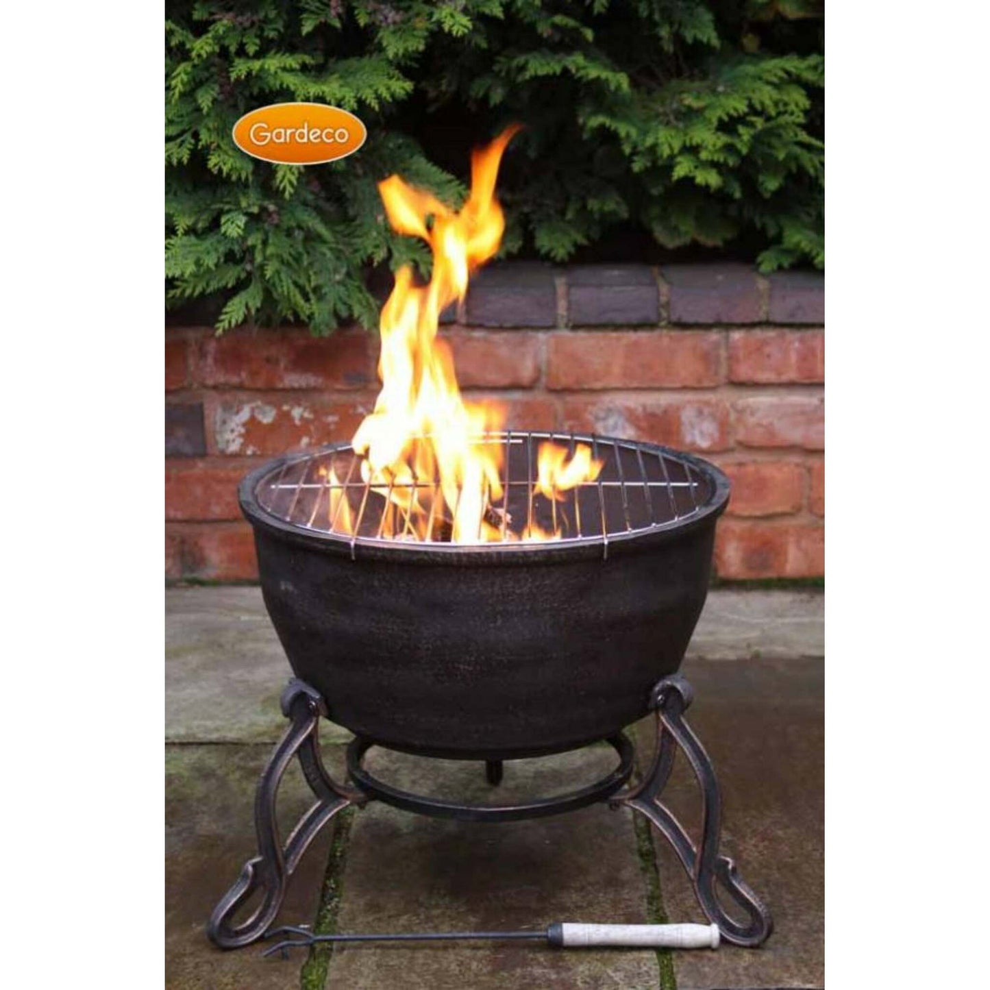 Fire pit with flames on a patio, featuring the Gardesco brand.