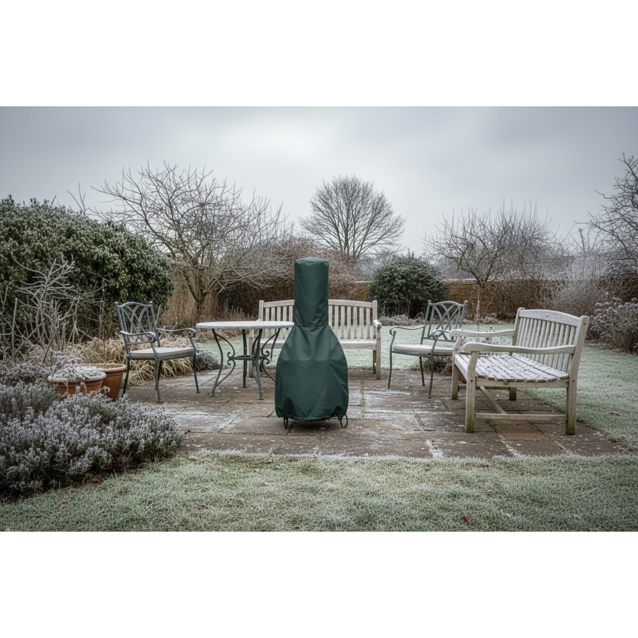 Outdoor patio set with a covered chiminea on a frosty day