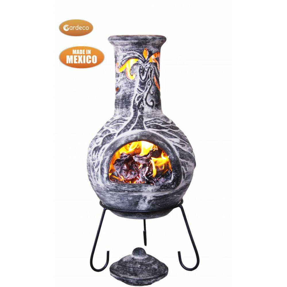 Decorative outdoor fireplace with glowing embers, made in Mexico, on a white background.