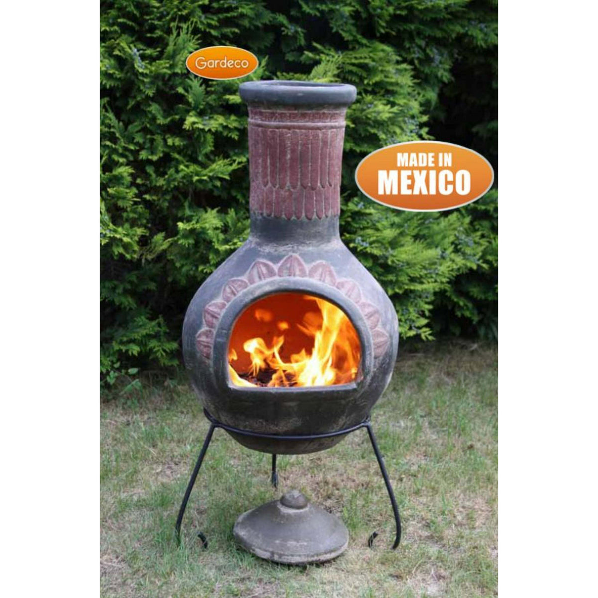 Gardeco himinea with flames inside, set against a green bush background.