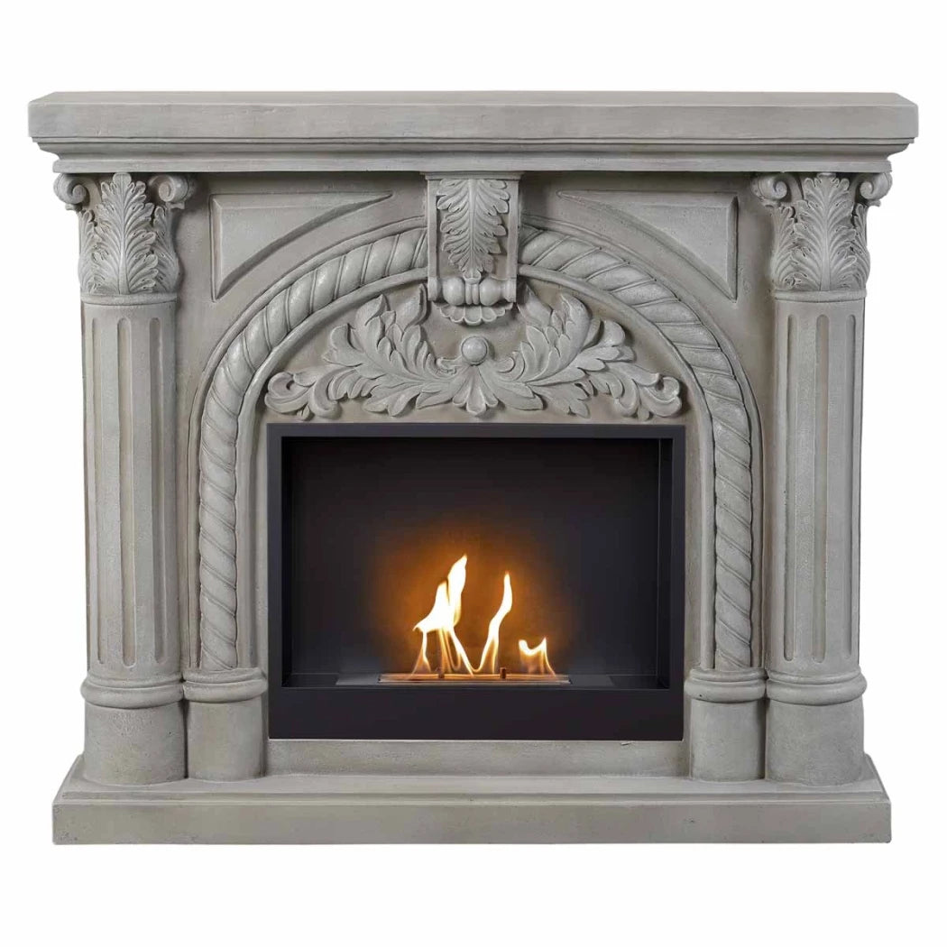 Decorative fireplace with intricate carvings and a small fire inside.