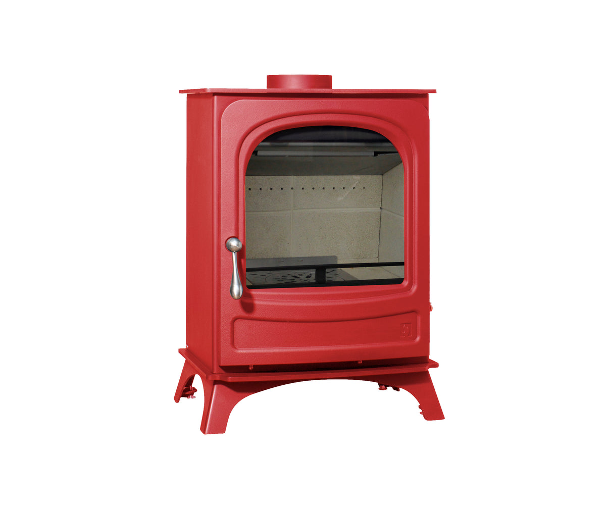 A red wood-burning stove with a glass door, silver handle, and stand, shown against a plain white background.