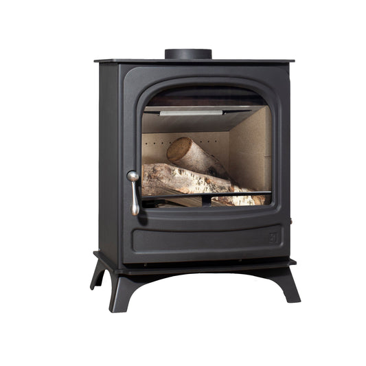 A black cast iron wood-burning stove with a glass front door, showing logs inside, on a solid white background.