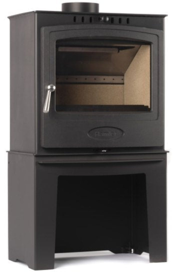 Black wood stove with glass door and log store underneath on a white background