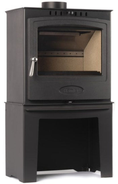 Black wood stove with glass door and log store underneath on a white background
