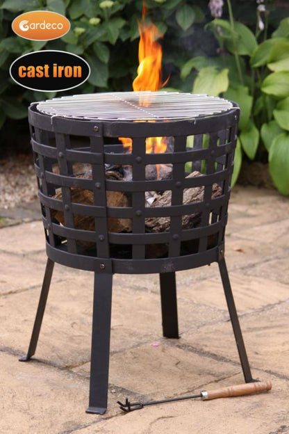 Cast iron fire pit with flames on a stone patio, featuring Gardeco branding.