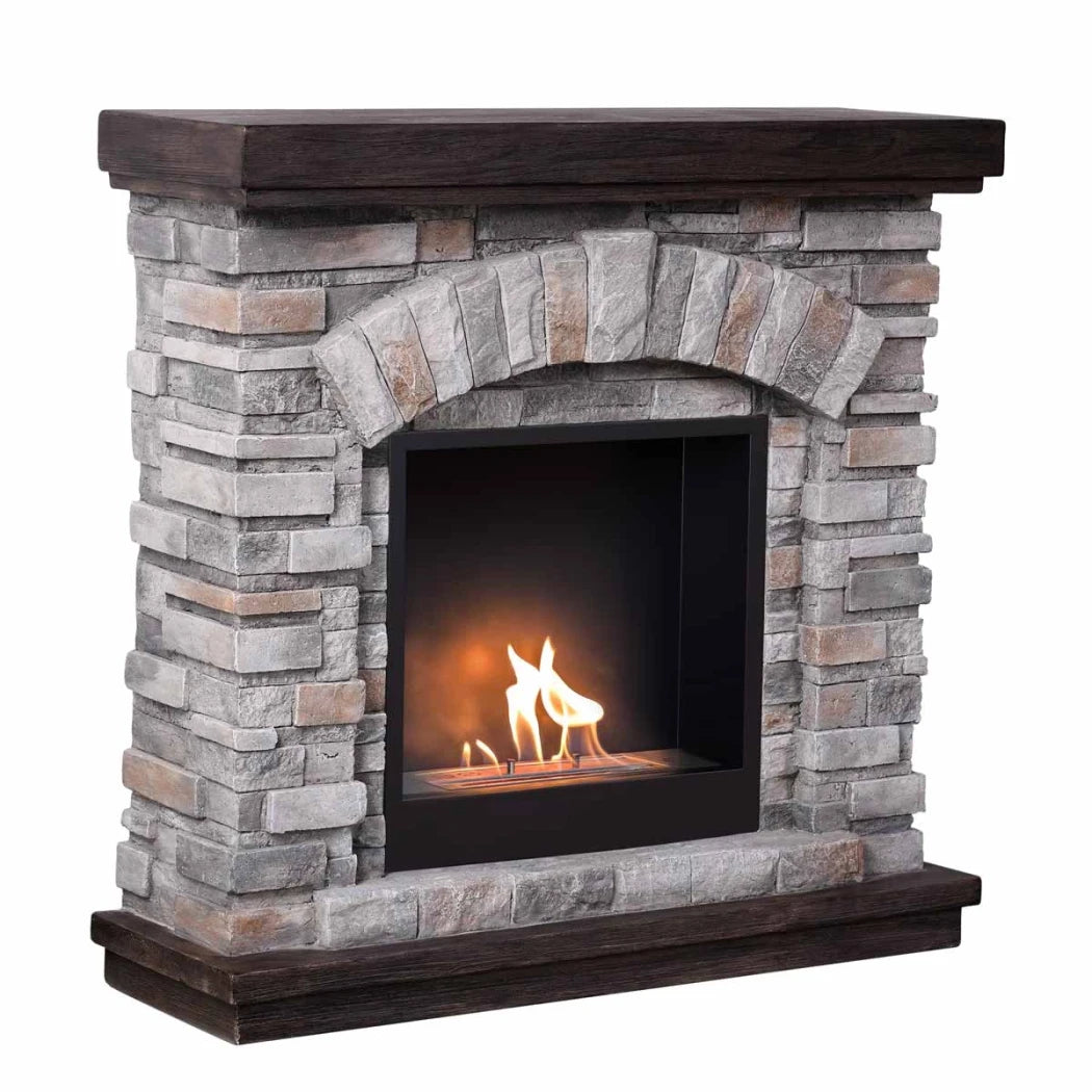 Stone fireplace with a dark wooden mantel on a white background