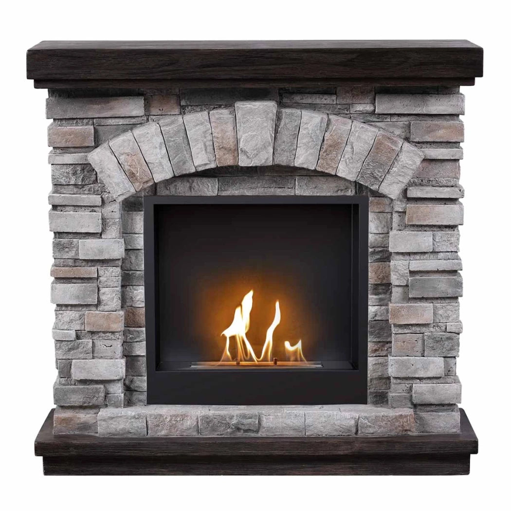 Stone fireplace with a lit fire inside on a white background
