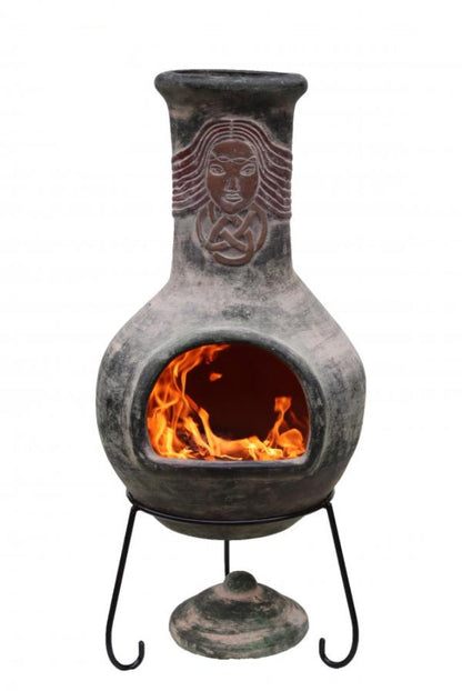 Ceramic chiminea with flames inside on a white background
