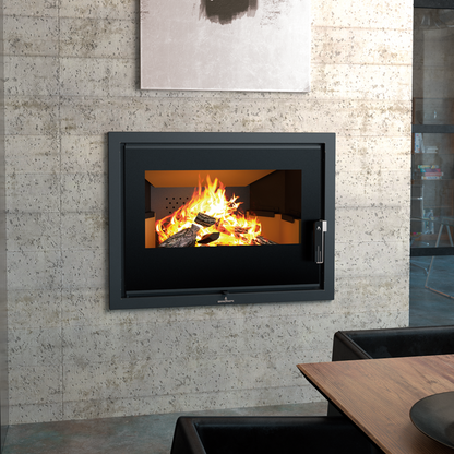 Bonpi Hydrobronpi 80E Vison Stove fireplace with flames inside, mounted on a stone wall in a room with a dining table.