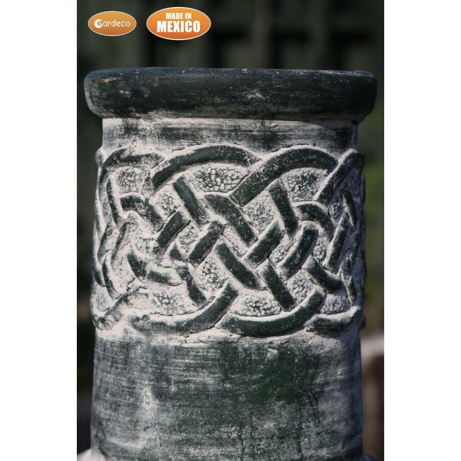 Chimenea close up Edyth Medium Celtic Mexican Chiminea Green | Clay on a blurred background.