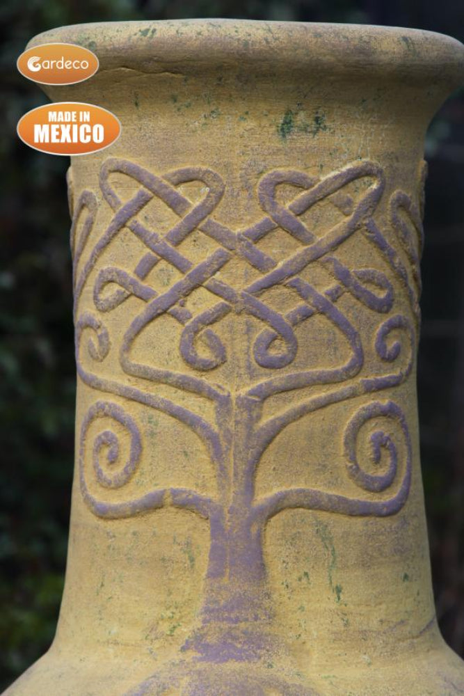 Close up of design on neck of Derwyn The Tree Mexican Chiminea – Charcoal with Tree Design - Mustard on a blurred background