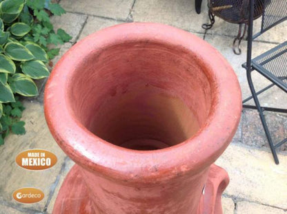 Close up of rim of Jumbo Tibor Mexican Chiminea – Reddish Brown with 'Made in Mexico' label on a patio background