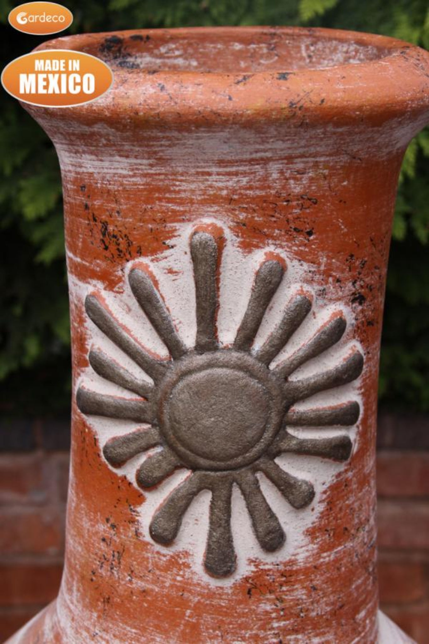 Terracotta pot with sun design and 'Made in Mexico' label