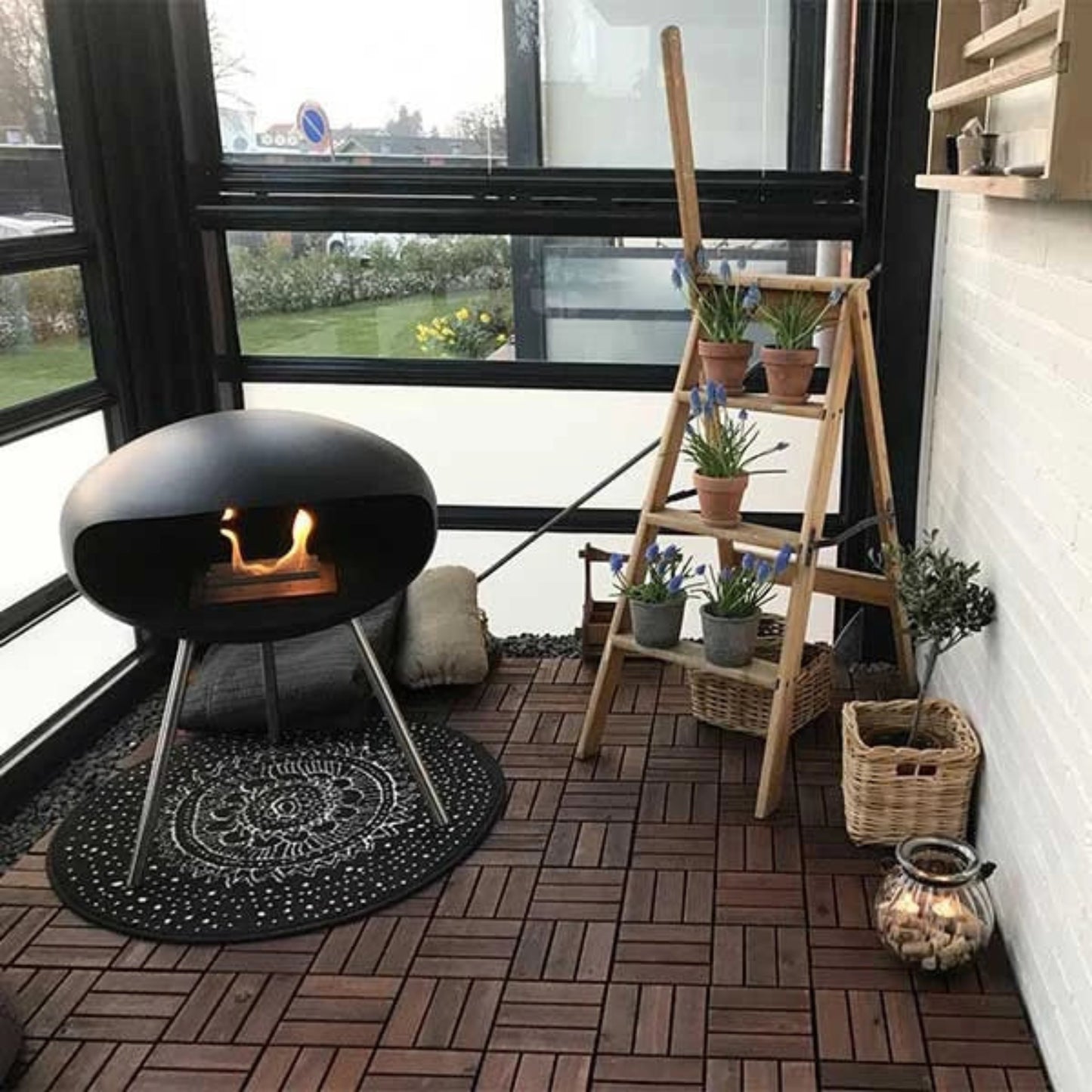 Cocoon Terra Freestanding Bioethanol Fireplace - Matte Black Steel Legs in conservatory