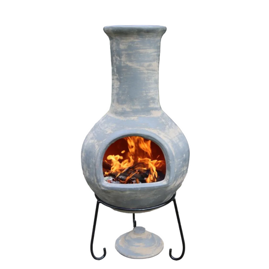 Ceramic chiminea with flames inside on a white background