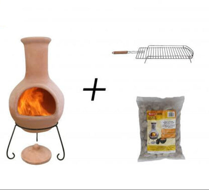 A Ceramico-style chimenea fireplace insert with a visible orange flame, shown on a white background alongside a metal grill rack and a bag of lava stones. 