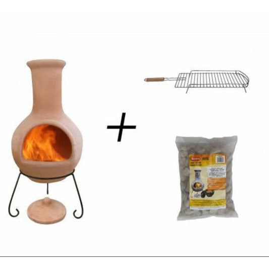 A Ceramico-style chimenea fireplace insert with a visible orange flame, shown on a white background alongside a metal grill rack and a bag of lava stones. 