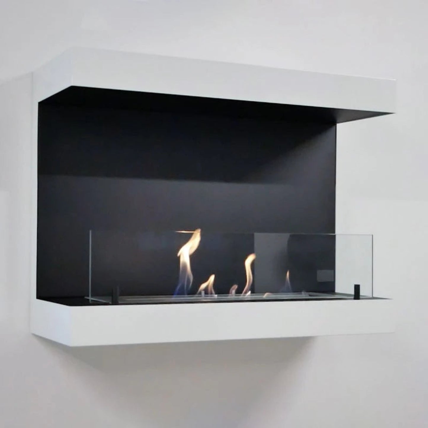 Modern wall-mounted ethanol fireplace with glass front on a white background