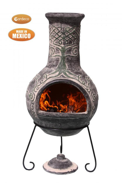 Decorative outdoor fireplace with flames inside, made in Mexico, on a white background.
