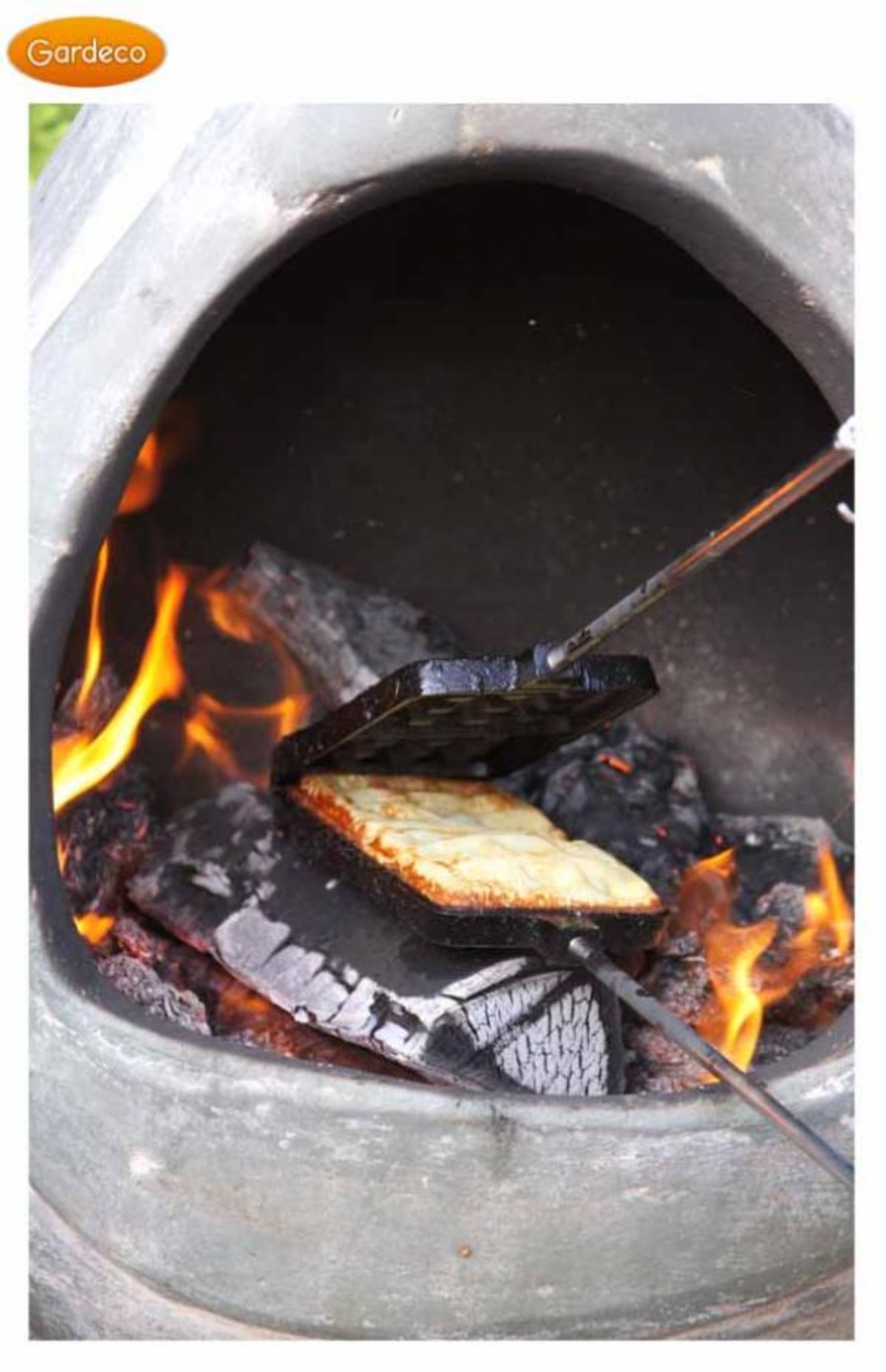 Waffle being cooked in a stone oven with flames and charcoal.