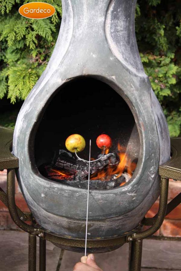 Chiminea with apples on toasting fork over a fire, brand 'Gardeco' visible