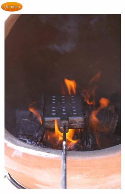 Fire pit with flames and a grill grate, featuring the Gardeco brand.