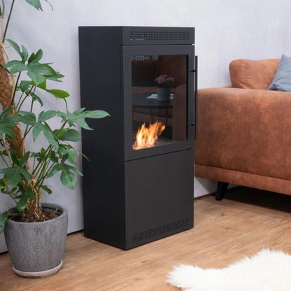 Modern black freestanding fireplace with flames in a living room setting.