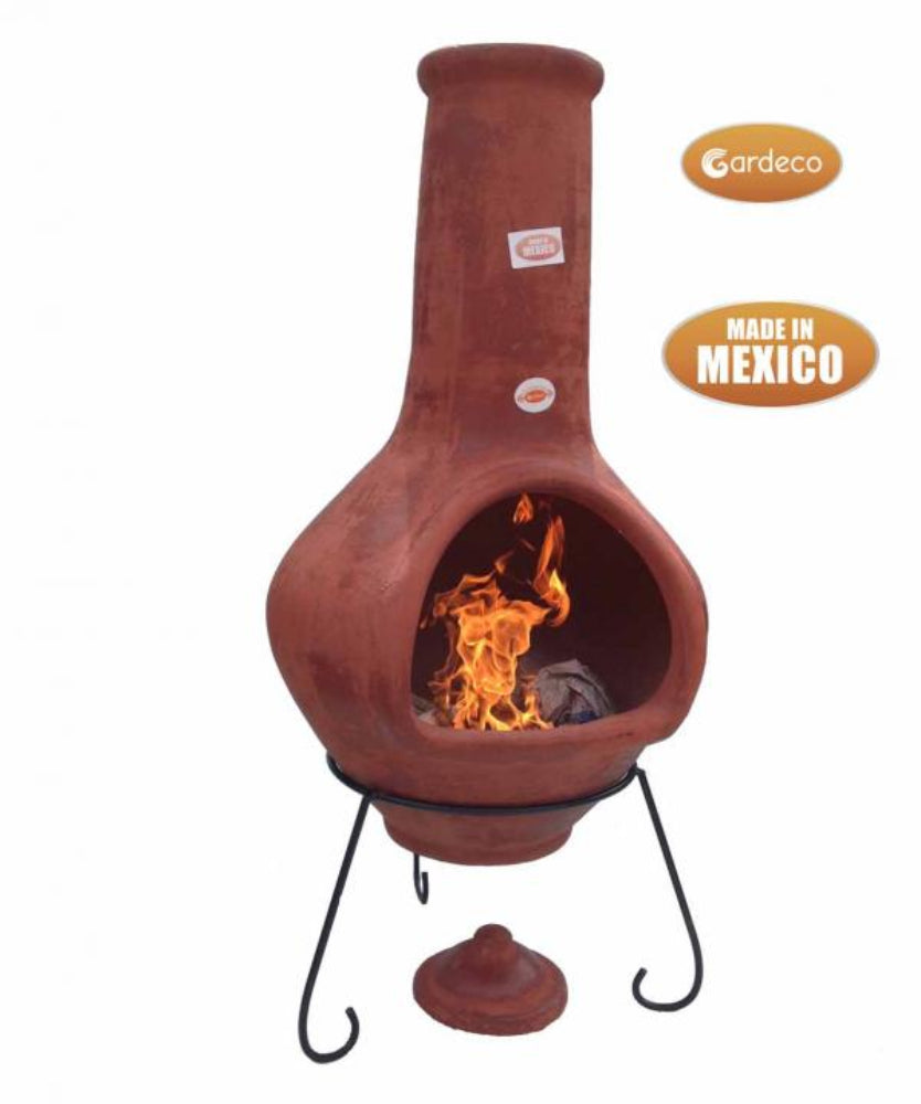 Terracotta chiminea with flames inside, made in Mexico, on a white background