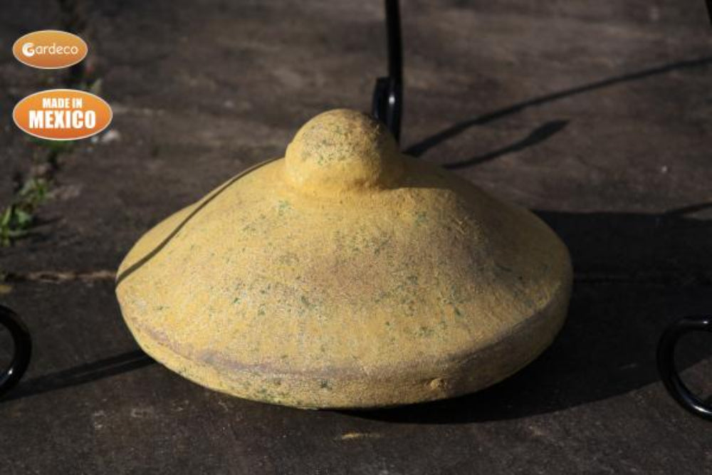 Lid of Derwyn The Tree Mexican Chiminea – Charcoal with Tree Design - Mustard on slate surface