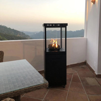Black outdoor fireplace on a patio with a scenic view