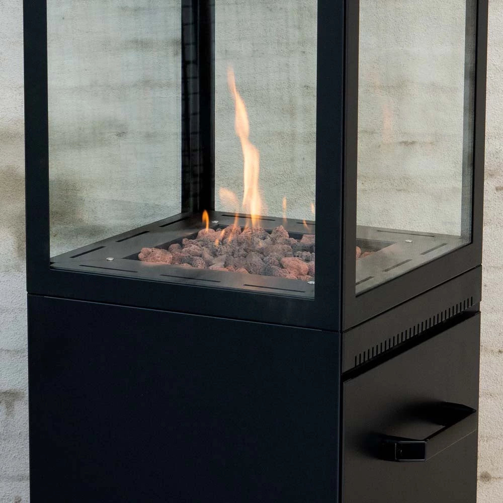 Modern outdoor fireplace with glass doors on a concrete wall background