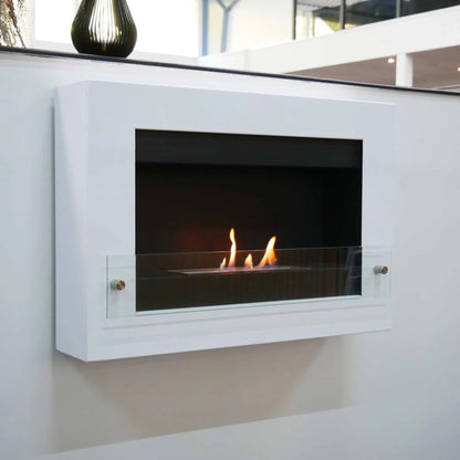 Modern wall-mounted bioethanol fireplace with flameson a white wall