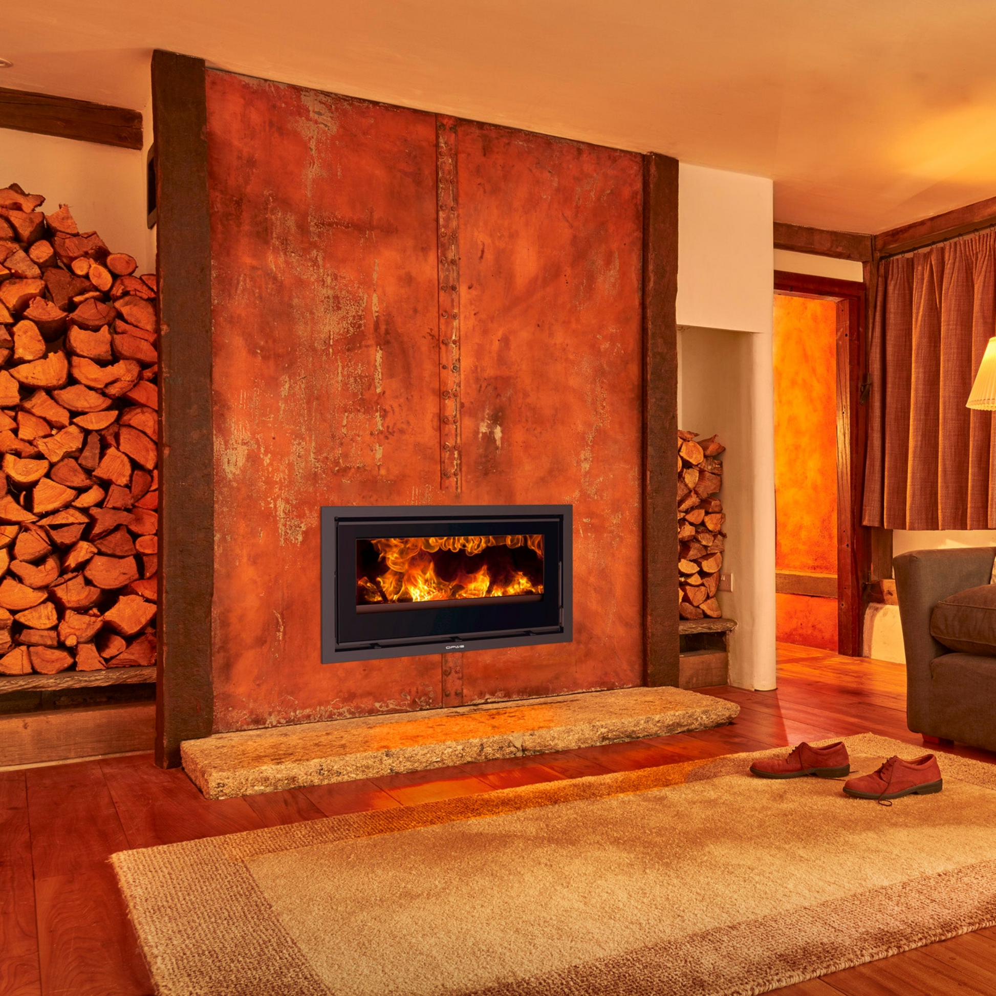 Opus Octave 90i stove in rustic burnt orange front room