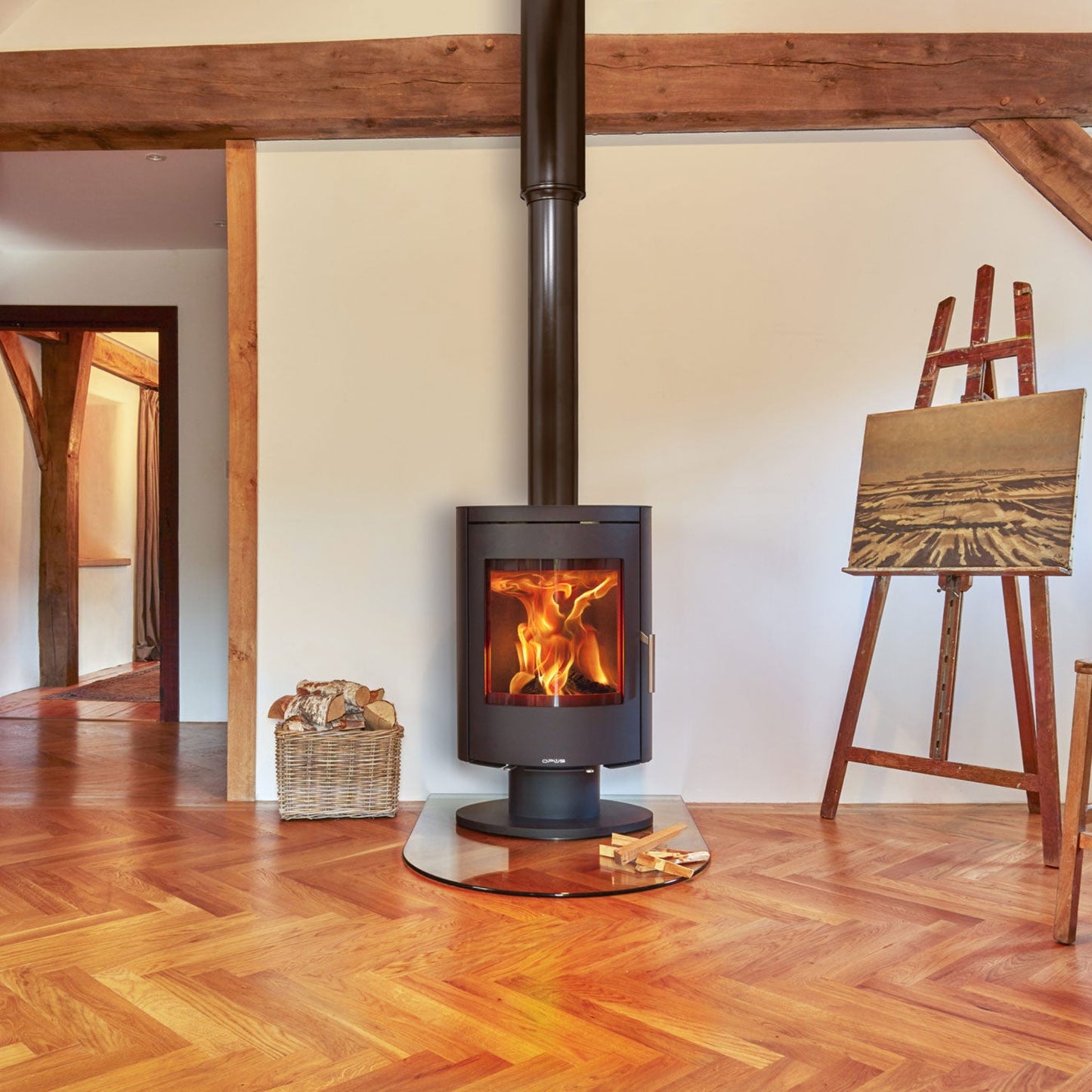 Opus Harmony Wood-burning stove in a room with wooden floor and exposed beams