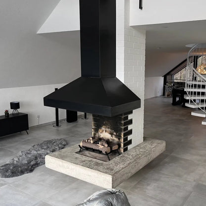 Modern fireplace with black hood in a stylish living room.