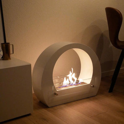 ScandiFlames Dallas Bio Fireplace with Arch – White, with flames on a wooden floor.