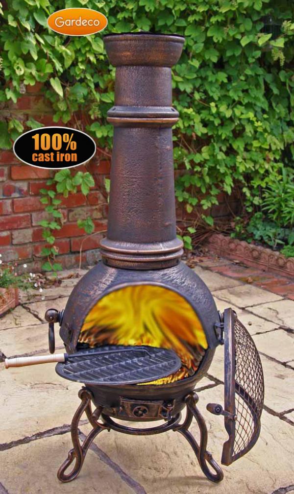 Cast iron chiminea with glowing interior on a patio