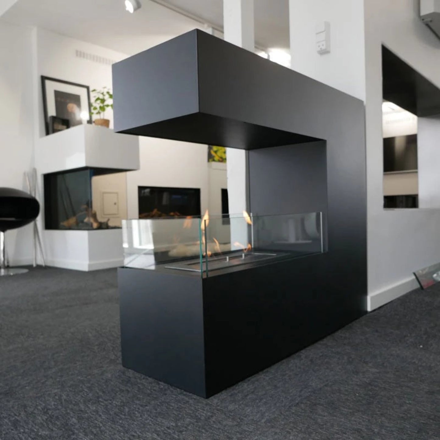 Modern black fireplace in a living room setting