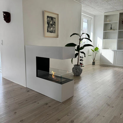 Modern living room with a white fireplace and wooden floor.