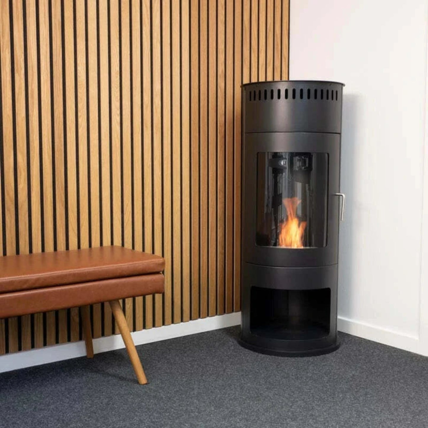 black-round-ethanol-wood-stove in corner of room