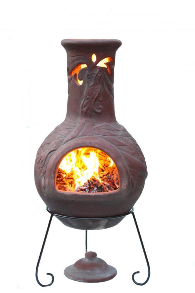 Decorative outdoor fireplace with flames inside, made in Mexico, on a white background.