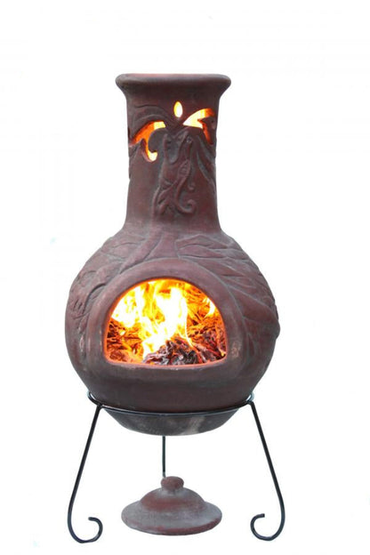Decorative outdoor fireplace with flames inside, made in Mexico, on a white background.
