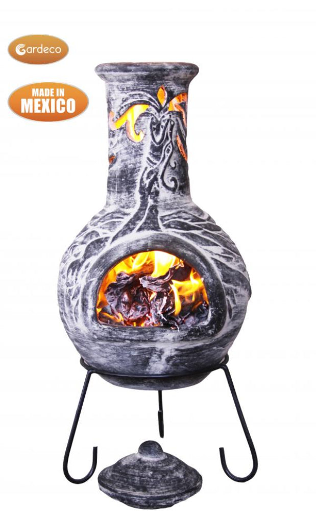 Decorative outdoor fireplace with glowing embers, made in Mexico, on a white background.