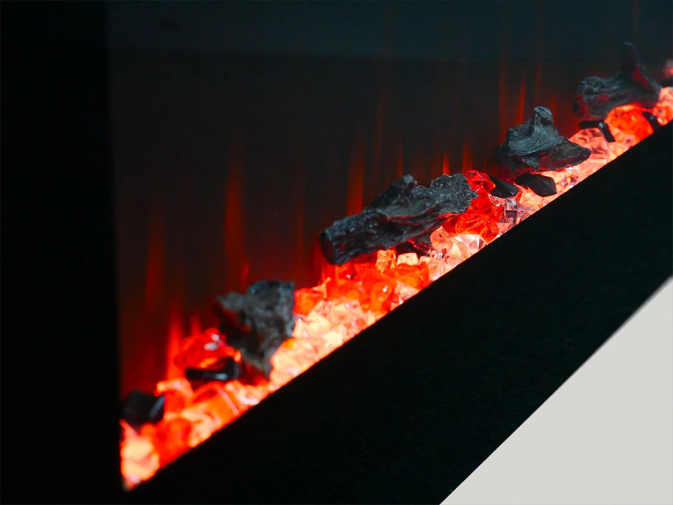 Close-up of glowing embers and flames in a fireplace