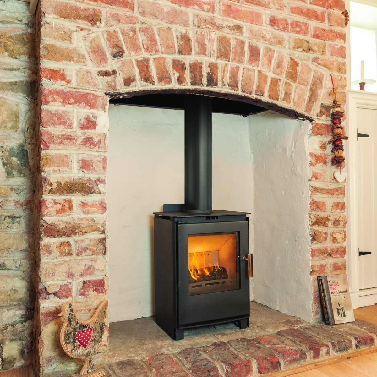 Beltane Brue Convector Plus installed in a fireplace