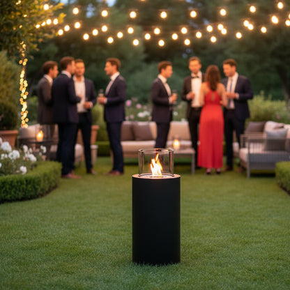 Black cylindrical  Scandiflames Dualis Bioethanol fire with a clear glass top at a garen party